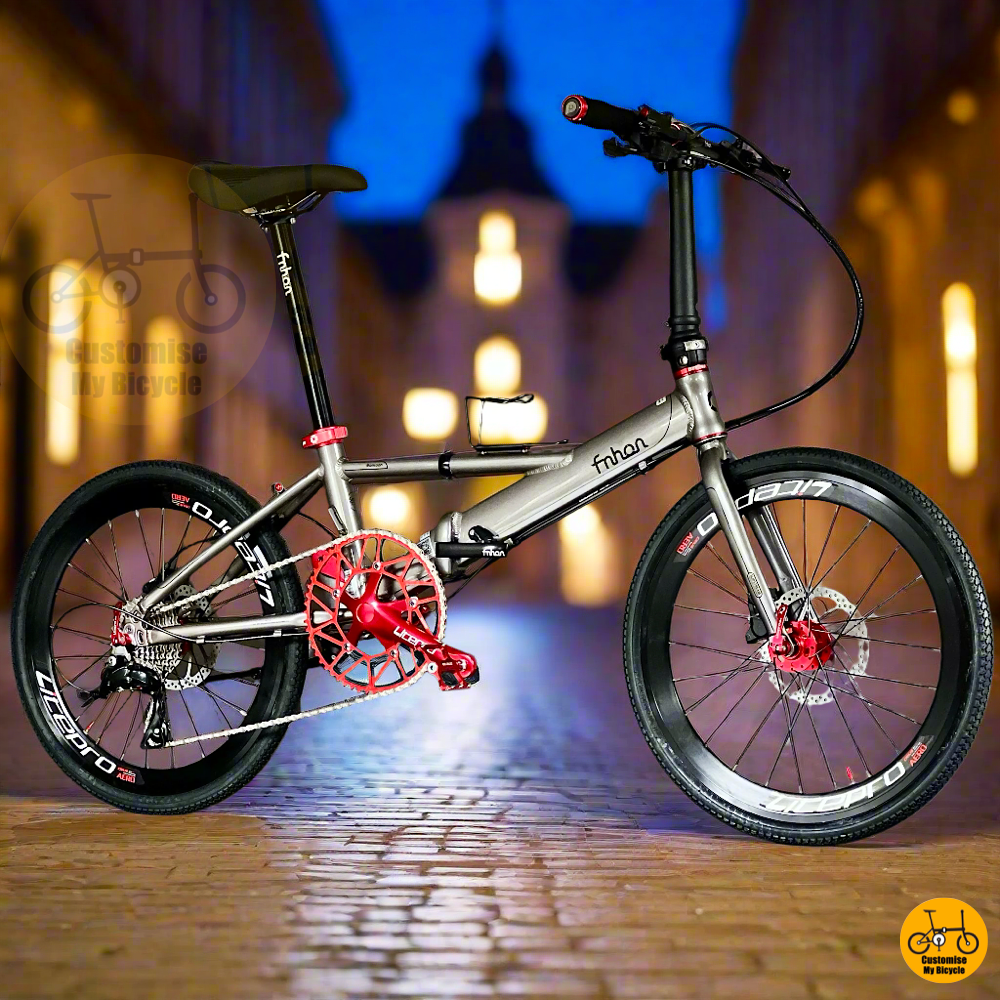 Fnhon Monsoon 22-inch foldable bike with Shimano 9s gearset and red accents – lightweight frame and hydraulic brakes  
