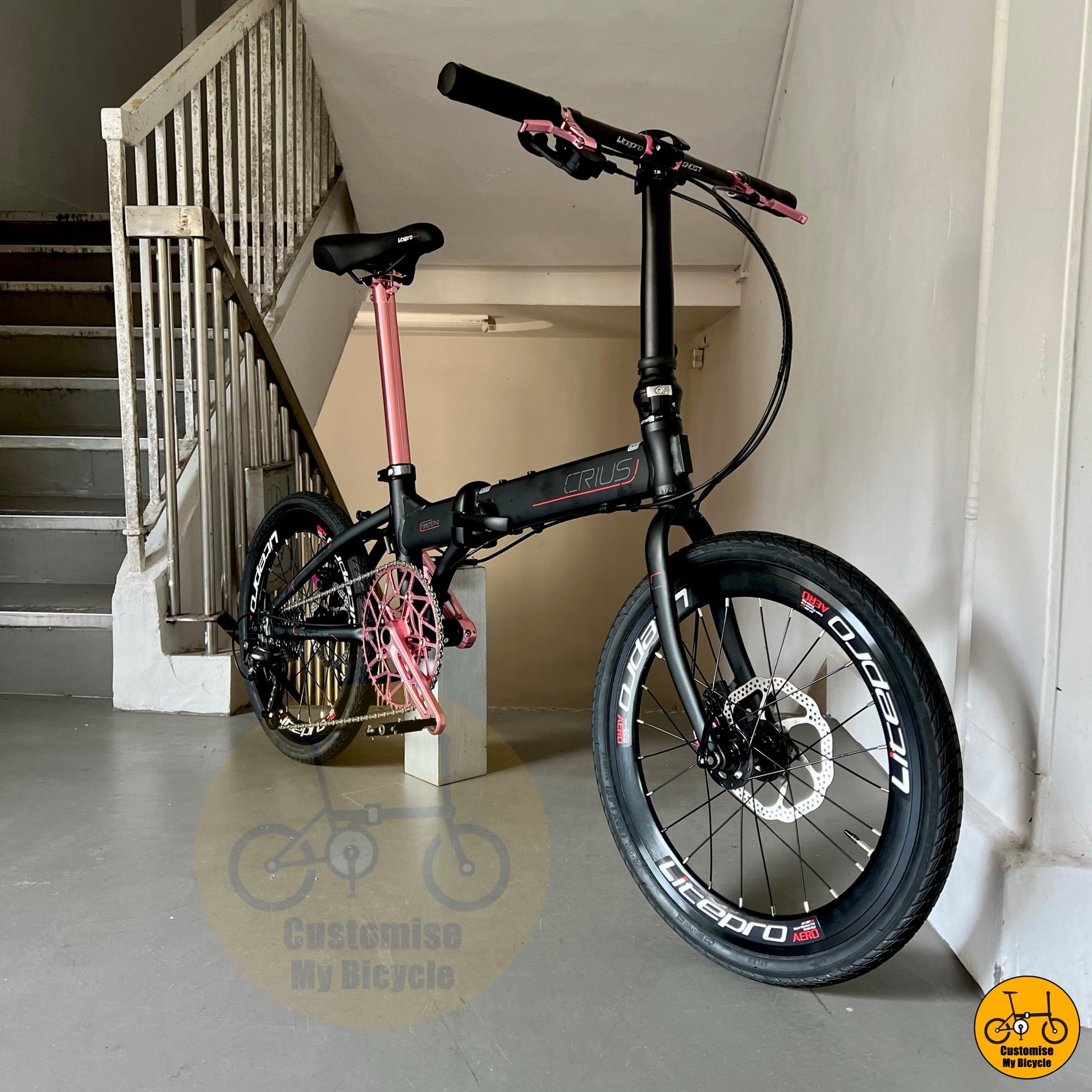 Litepro-equipped foldable bike with Shimano 9s and baby pink details for daily commutes