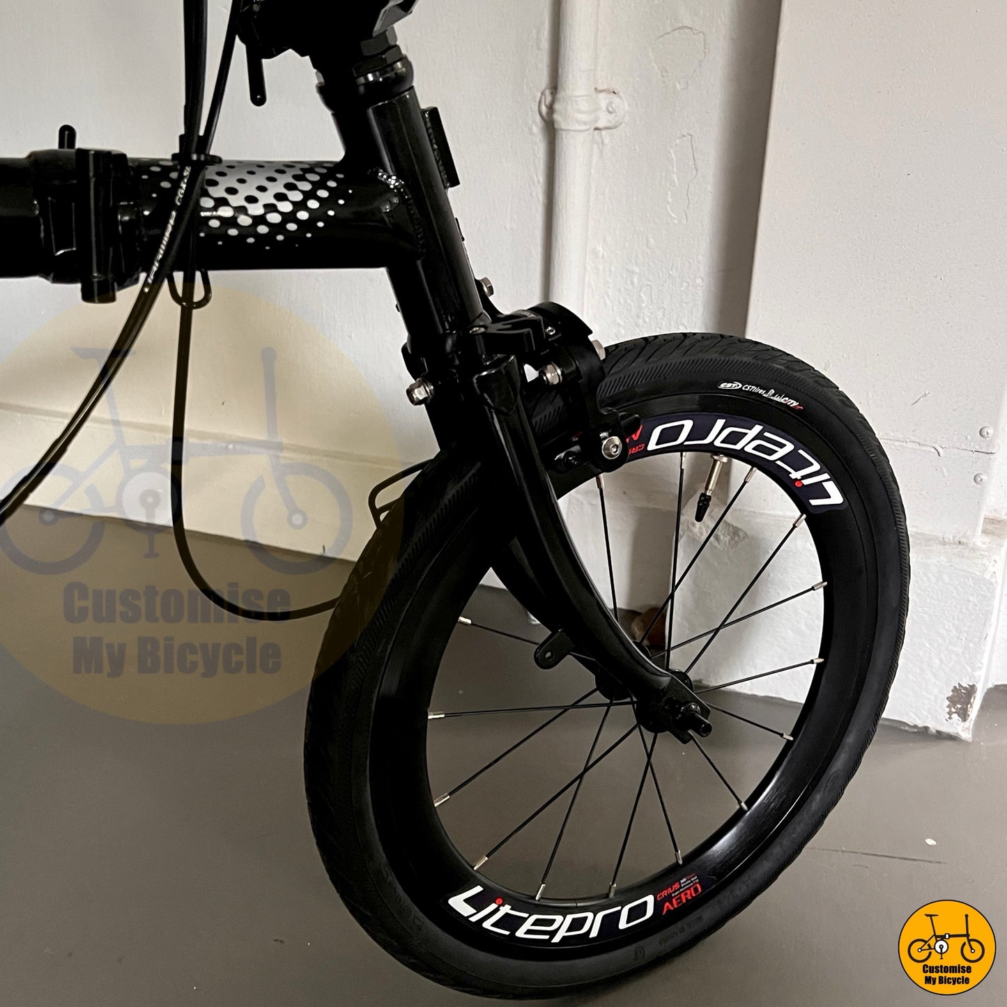 Close-up of rear derailleur and CST tyres on Crius Trifold
