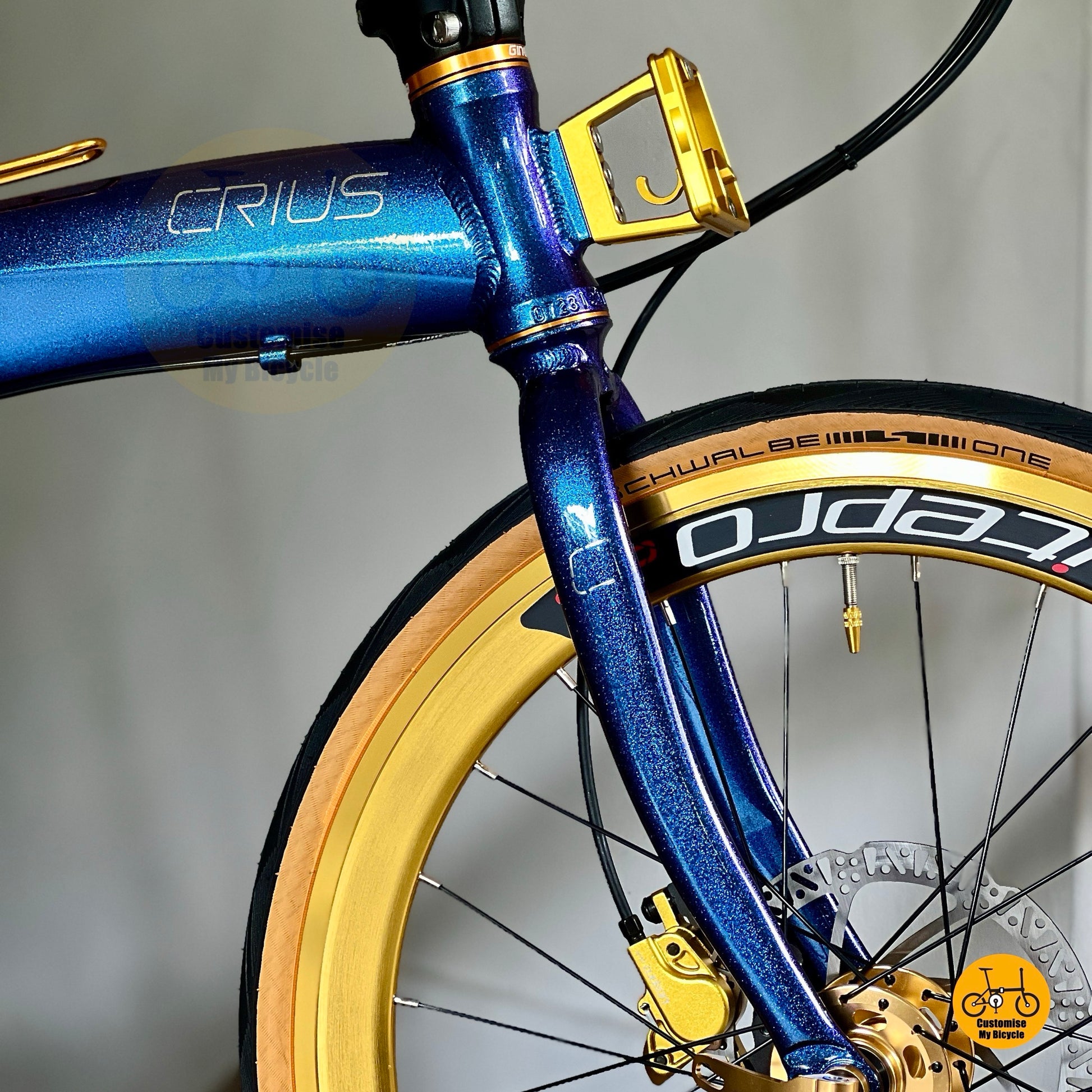 Crius Velocity folding bike in chameleon blue with gold accents
