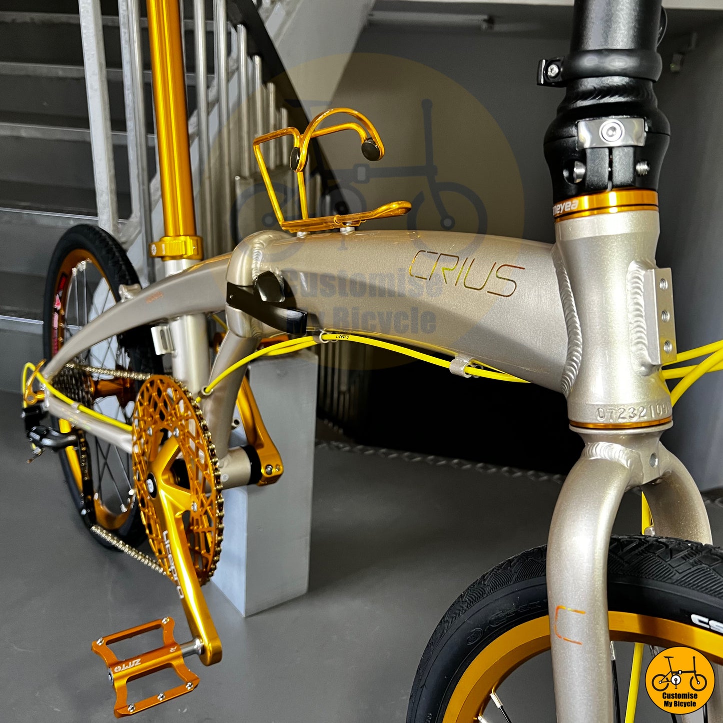 Close-up of Litepro crankset with unique gold chainring on a Crius Velocity foldable bike