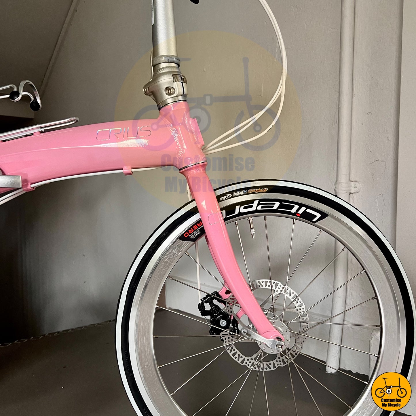 Hello Kitty-inspired pastel pink folding bike with lightweight aluminum frame
