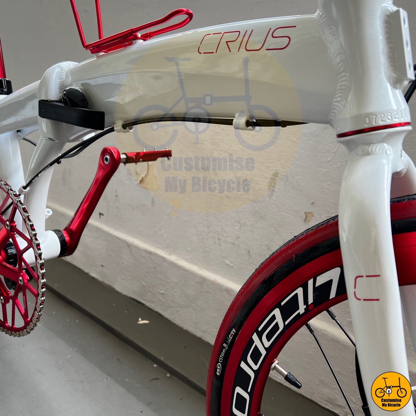 Snow white folding bicycle with a striking red and black color scheme
