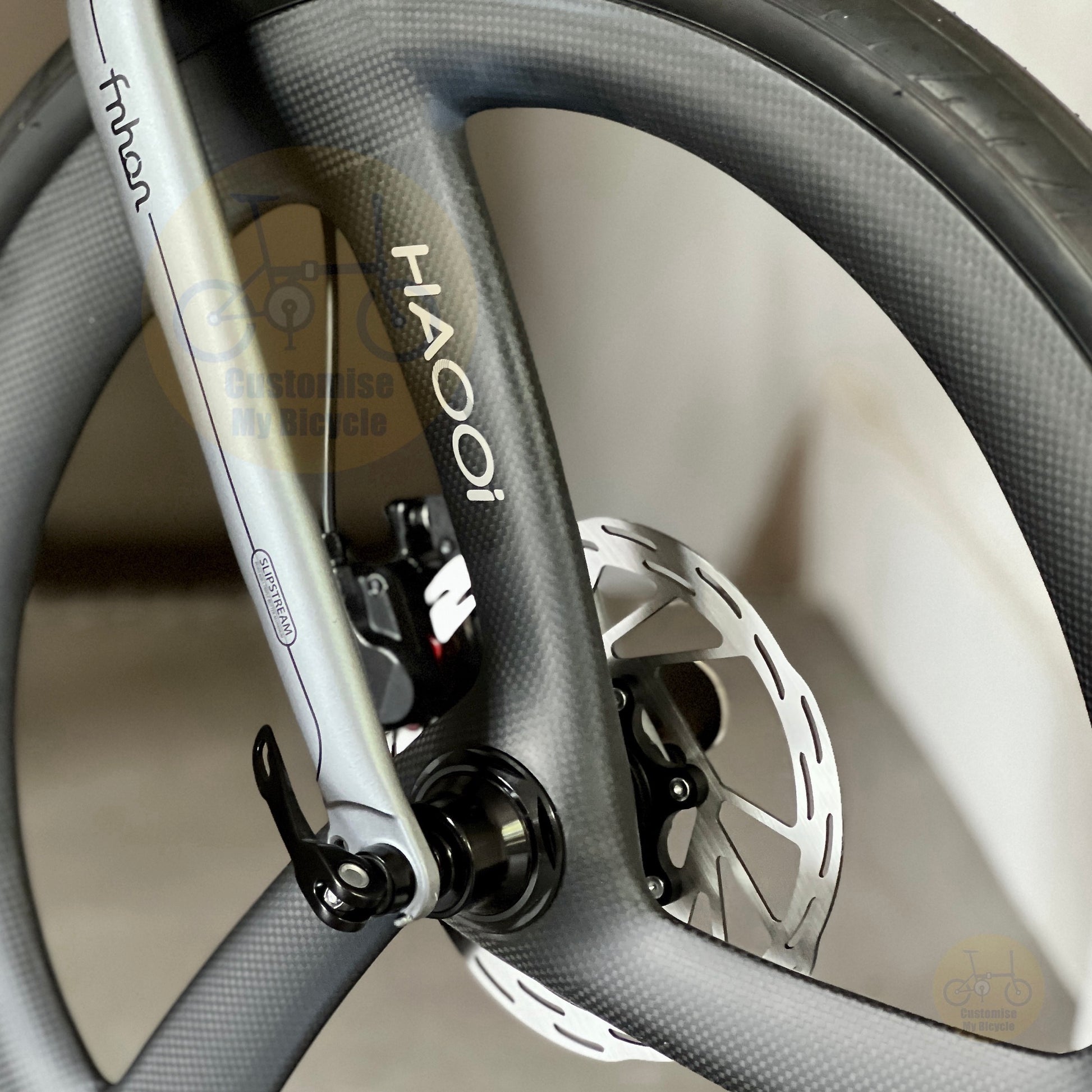 Fnhon Blast folding bike close up of front HAOOI Carbon Ultra Trispokes wheelset