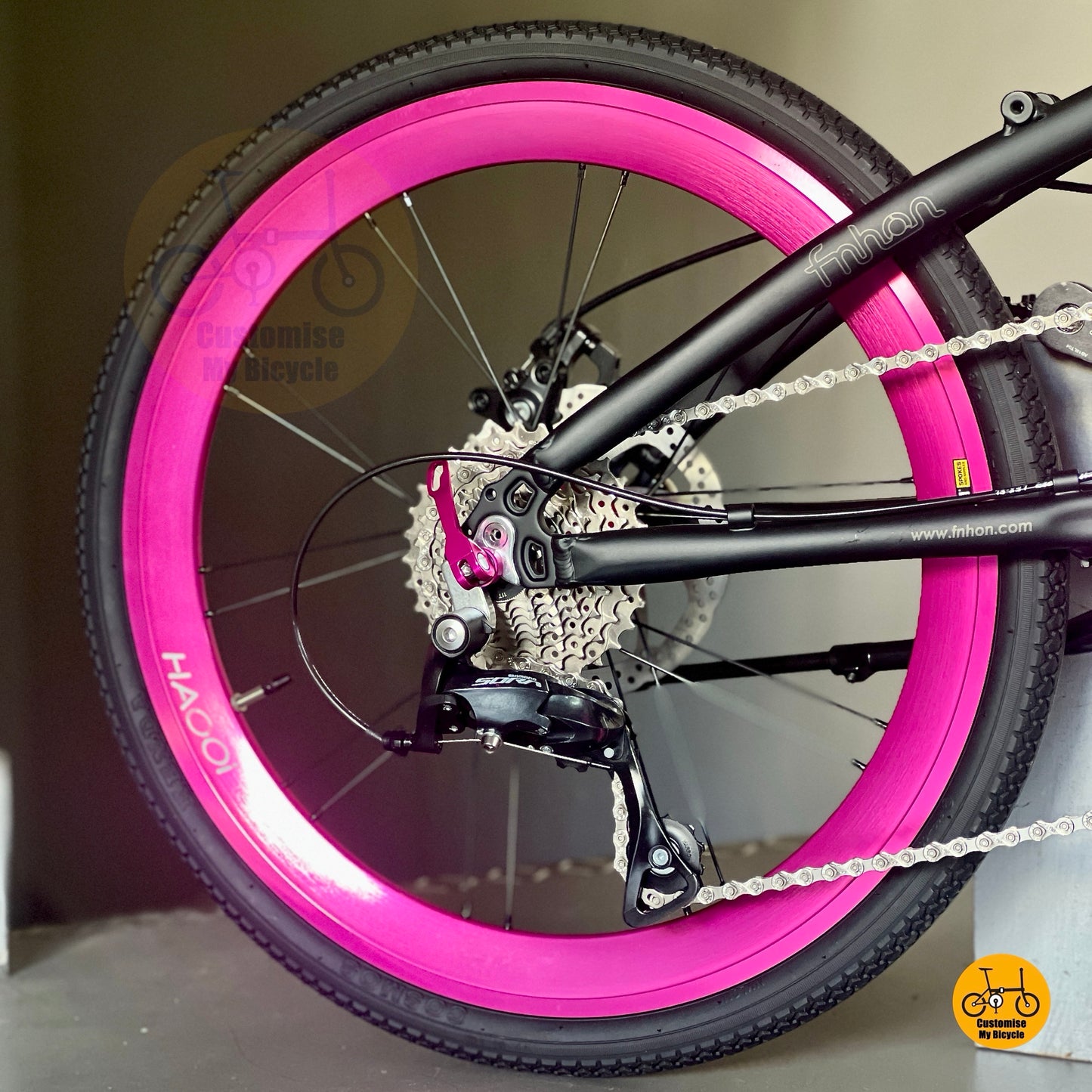 Matte black frame with hot pink components
