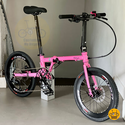 Higher front view of Fnhon Gust folding bike showcasing hot pink aluminium frame
