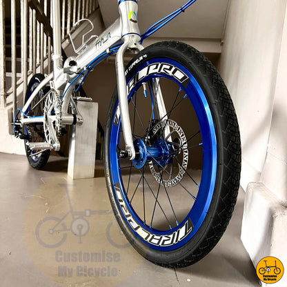 City folding bicycle with aerodynamic wheels and silver tone
