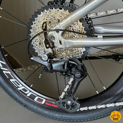 12s Shimano Deore M6100 derailleur on polished Fnhon bike  
