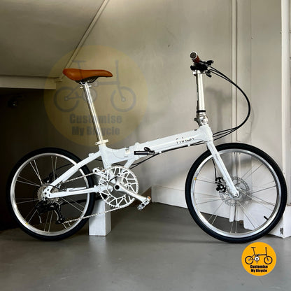 Snow white foldable bike with low profile wheels and smooth 9-speed shifting LTwoo drivetrain
