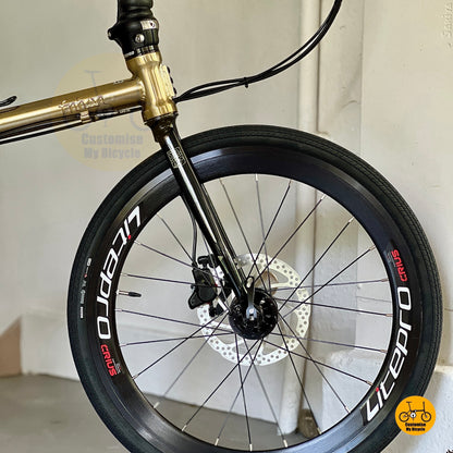 Front wheel close up showing Litepro Aero high profile rims and Maxxis 451 tyres
