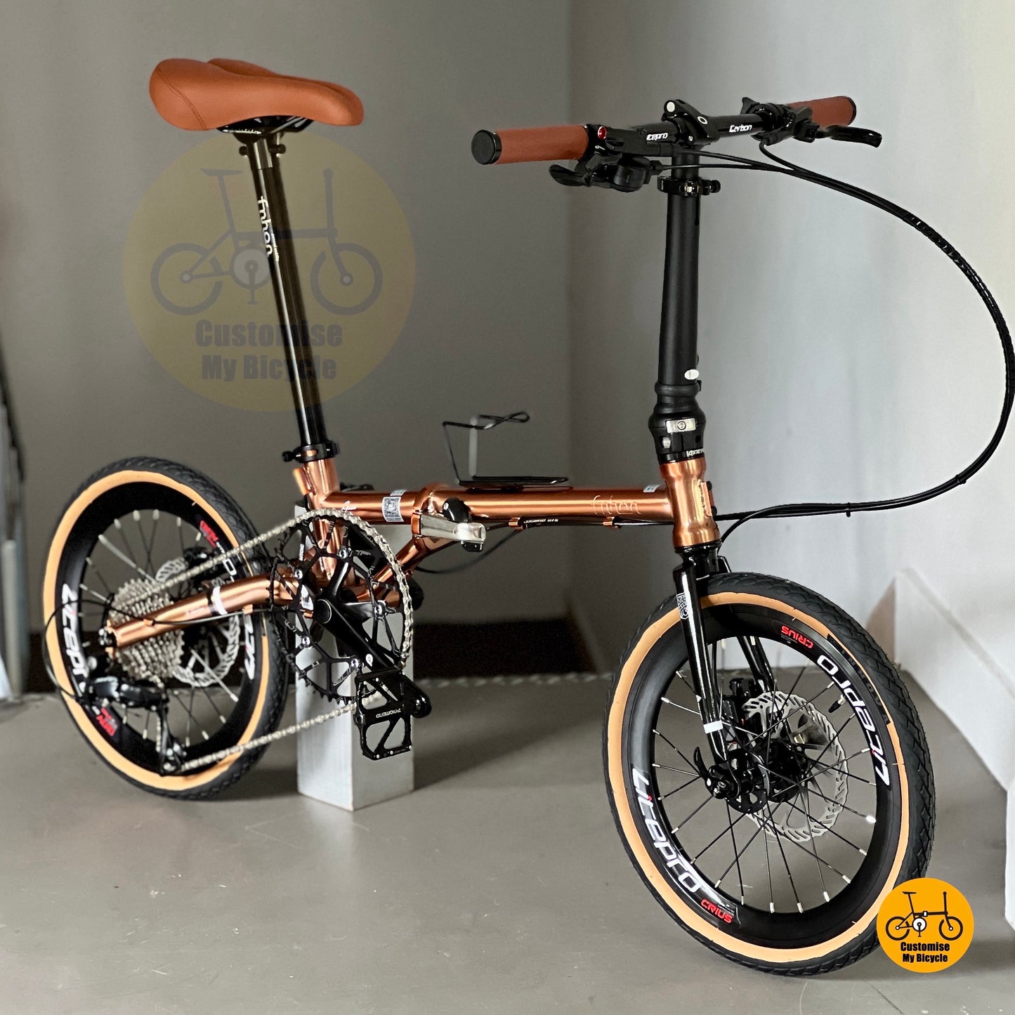 Full bike on display showing Fnhon Gust 18 inch Rose Gold colour tone, slim folding frame and elegant proportions