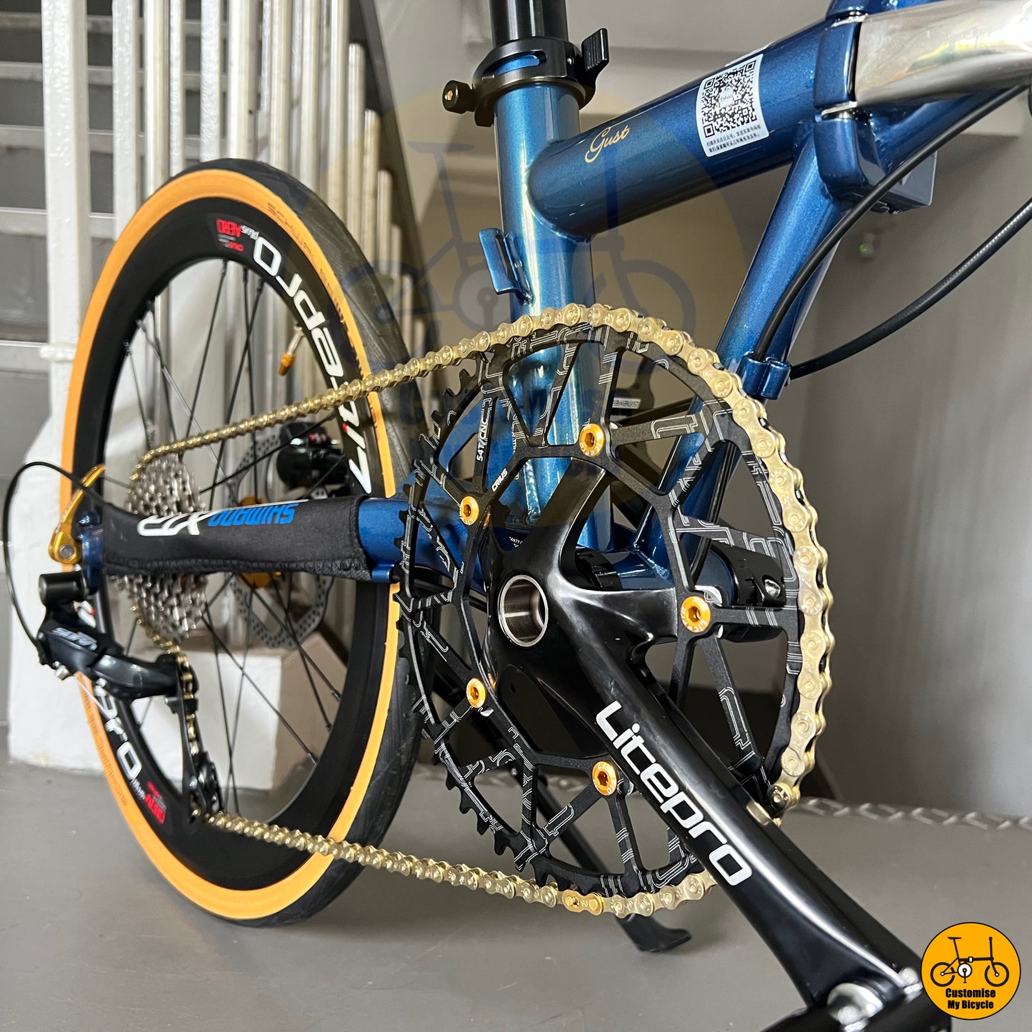 Deep sea blue and tan wall folding bike with high-quality components
