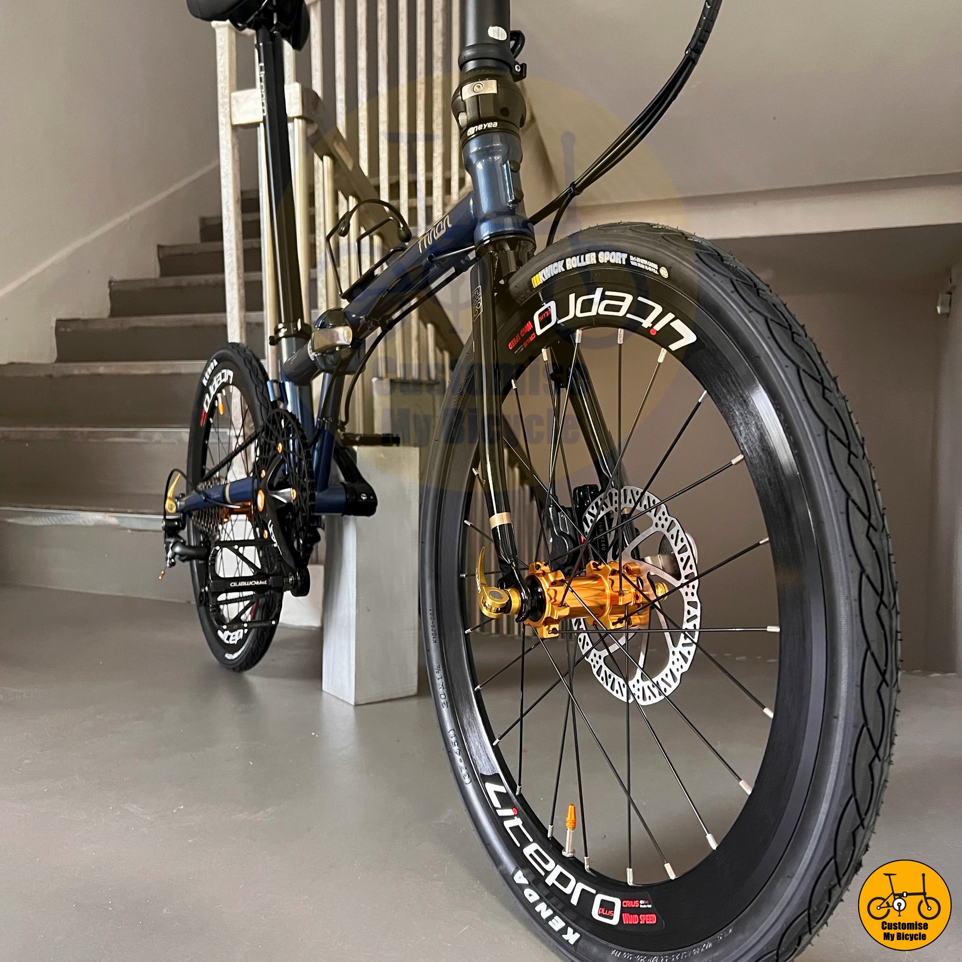 Sporty and modern folding bicycle with black aero rims
