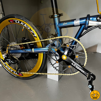 Folding bicycle with gold-accented rims and premium components
