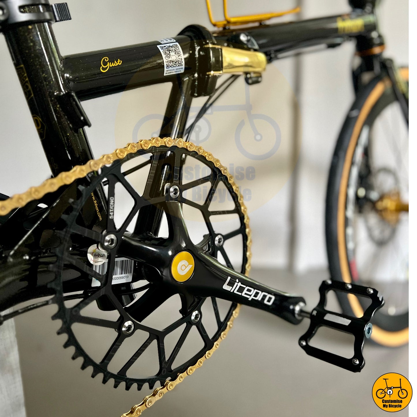 Gold-accented chain adding style to the black gold folding bike
