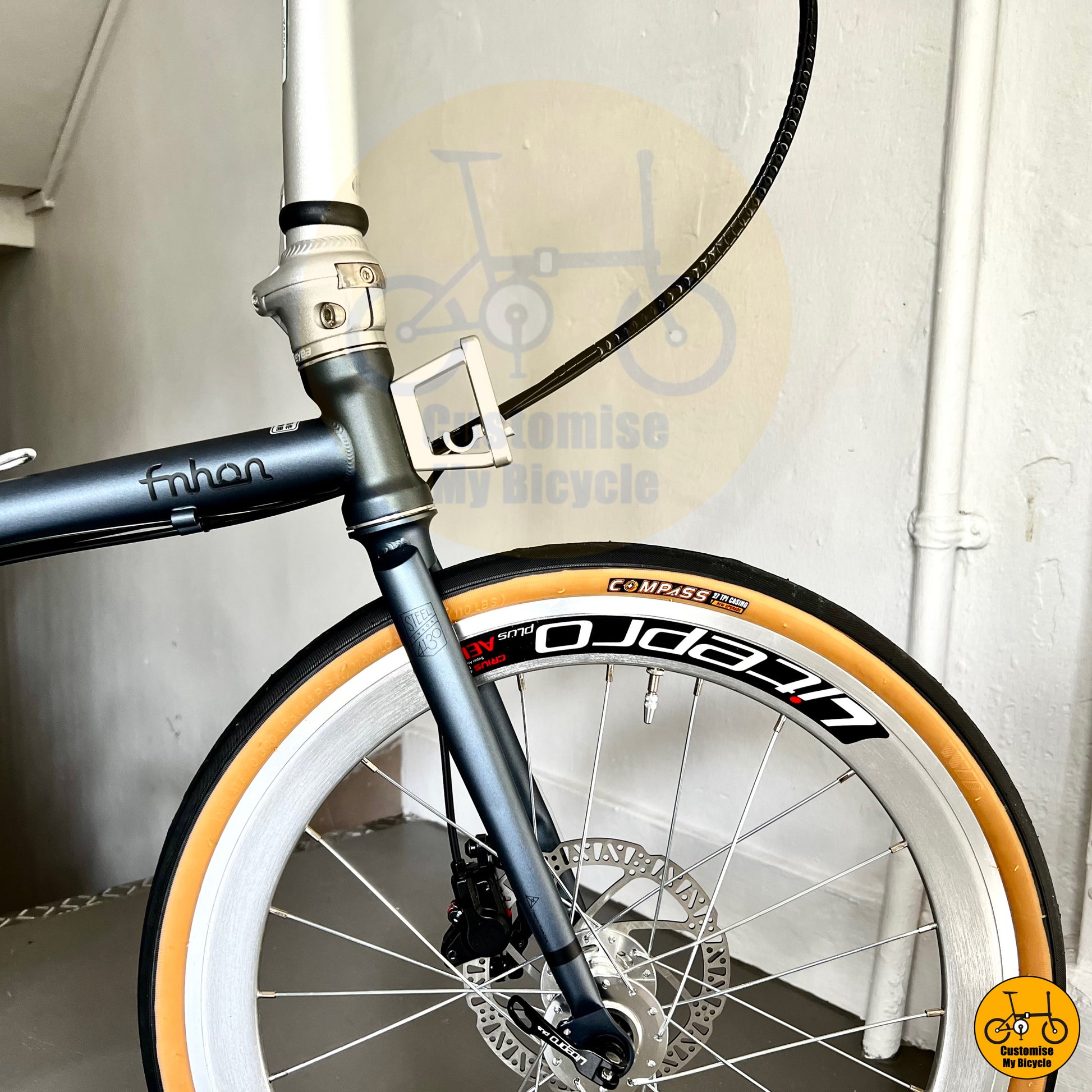 Compact and sleek foldable bike with a front block adaptor for accessories
