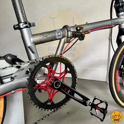 Carbon chainring on high-performance folding bike with aerodynamic carbon wheels
