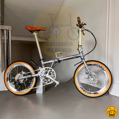 Foldable bicycle in matte Battleship Grey with retro chrome accents and comfy posture geometry  
