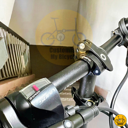 Shimano Sora shifter on emerald green foldable bicycle with ergonomic handlebar setup
