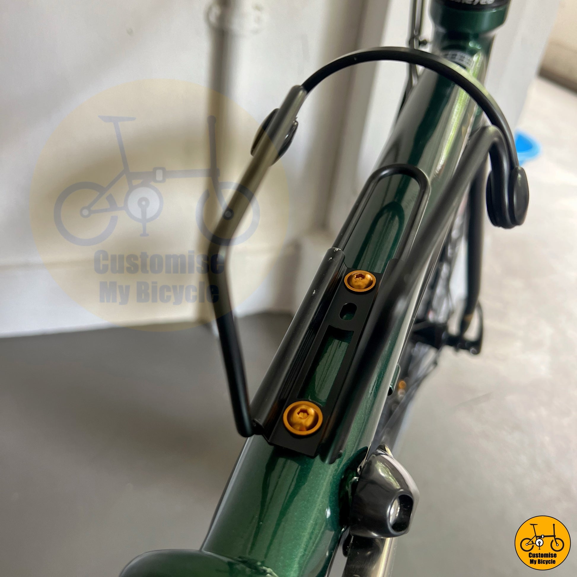 Postal green folding bike with classic round bar design  
