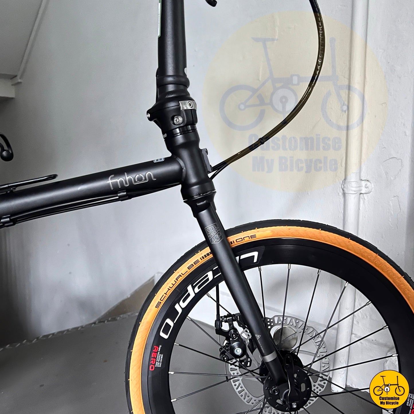 Fnhon Gust folding bike with Litepro rims and tan tyres
