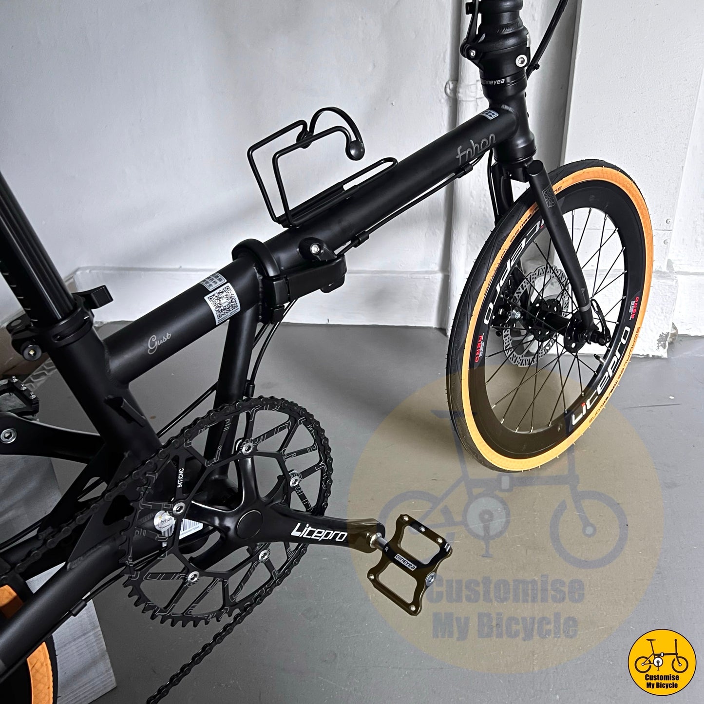 20-inch folding bike with black cockpit and components

