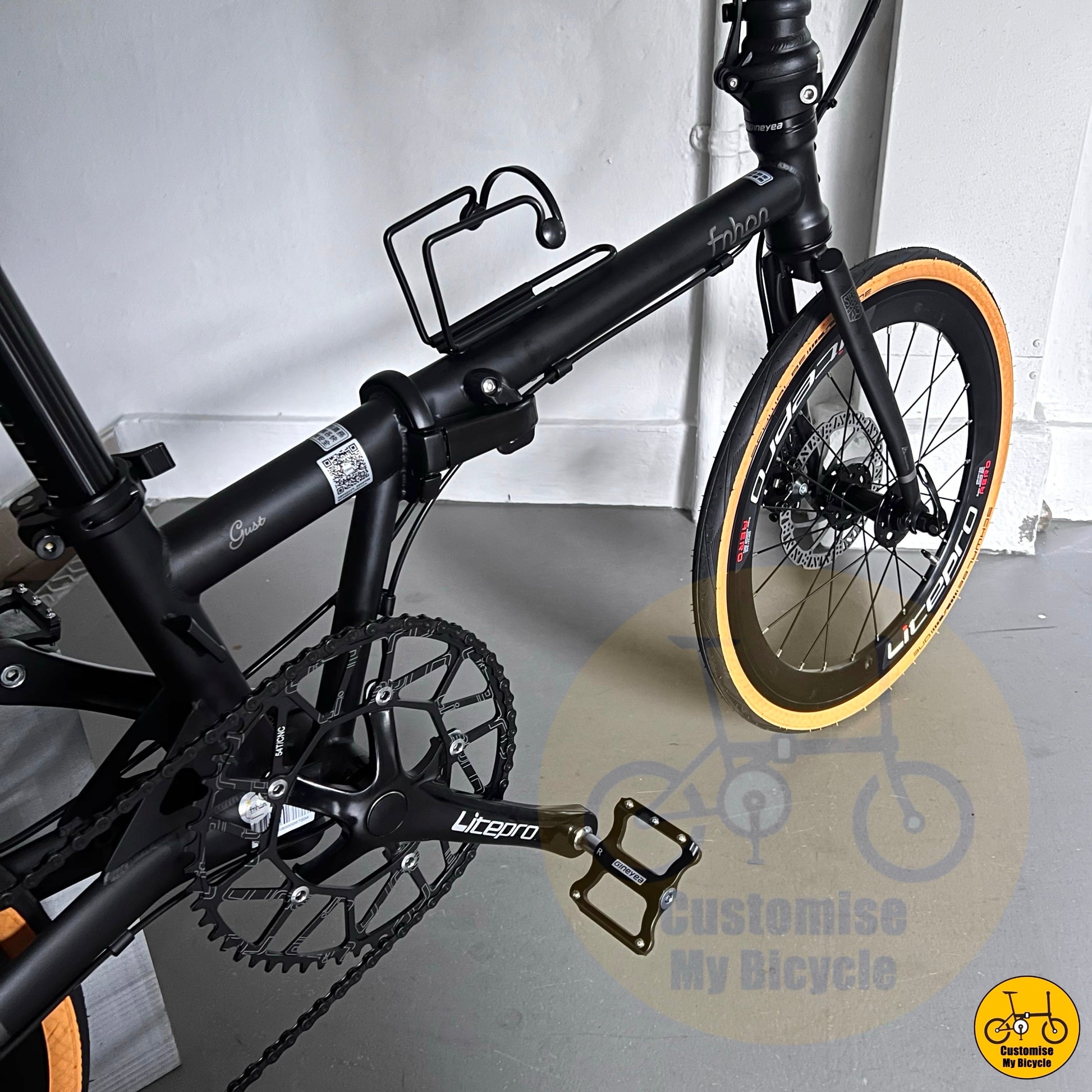 20-inch folding bike with black cockpit and components

