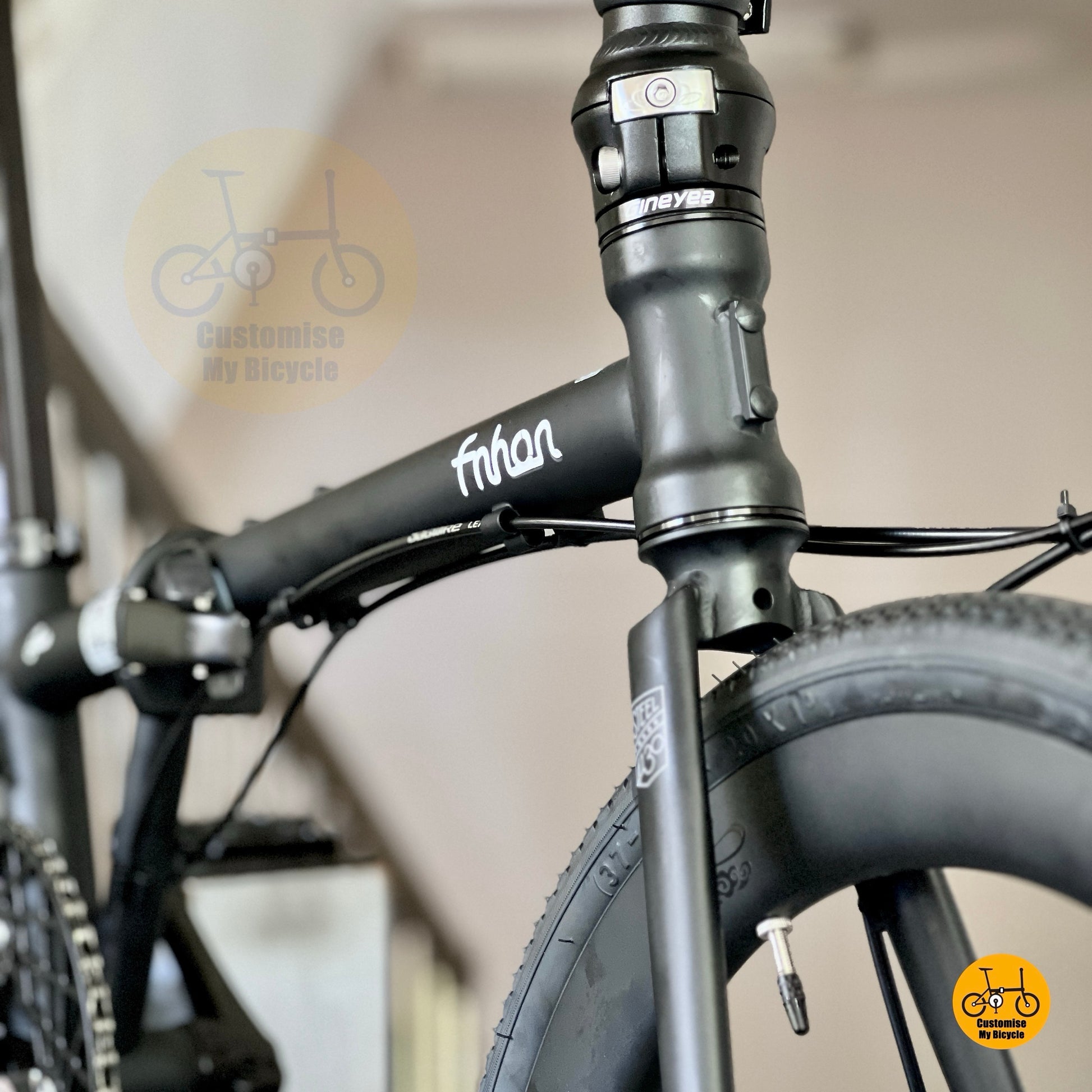 Lower front angle highlighting Matte Black fork and carbon straight bar
