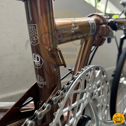 Hand-made rose gold frame bicycle with Shimano drivetrain and responsive brakes
