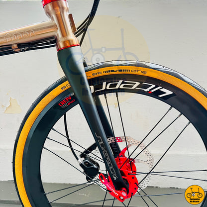 Foldable city bike with a premium rose gold frame and Silverock carbon front fork
