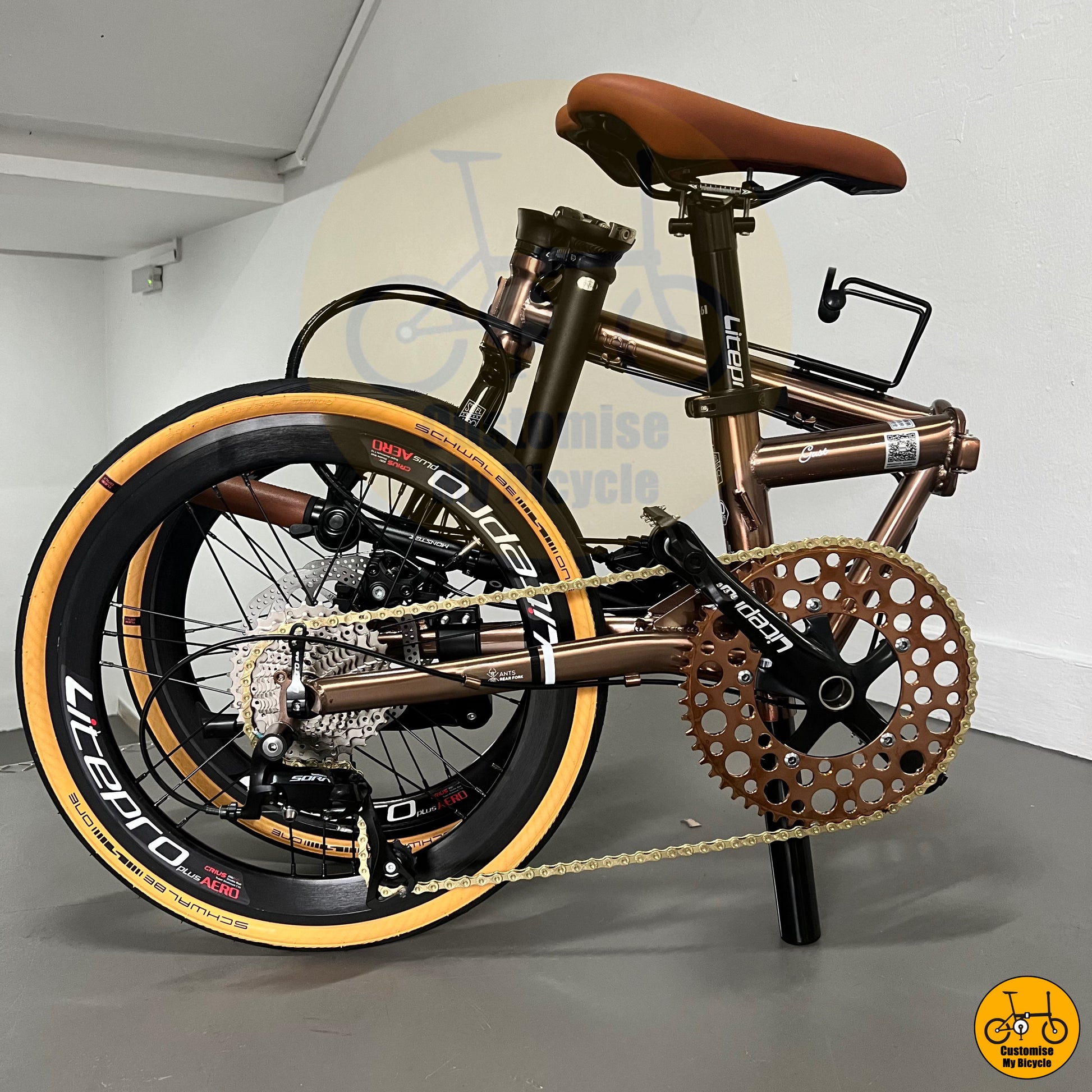 Compact folded dimension of custom-built Fnhon Gust foldie with ergonomic brown saddle
