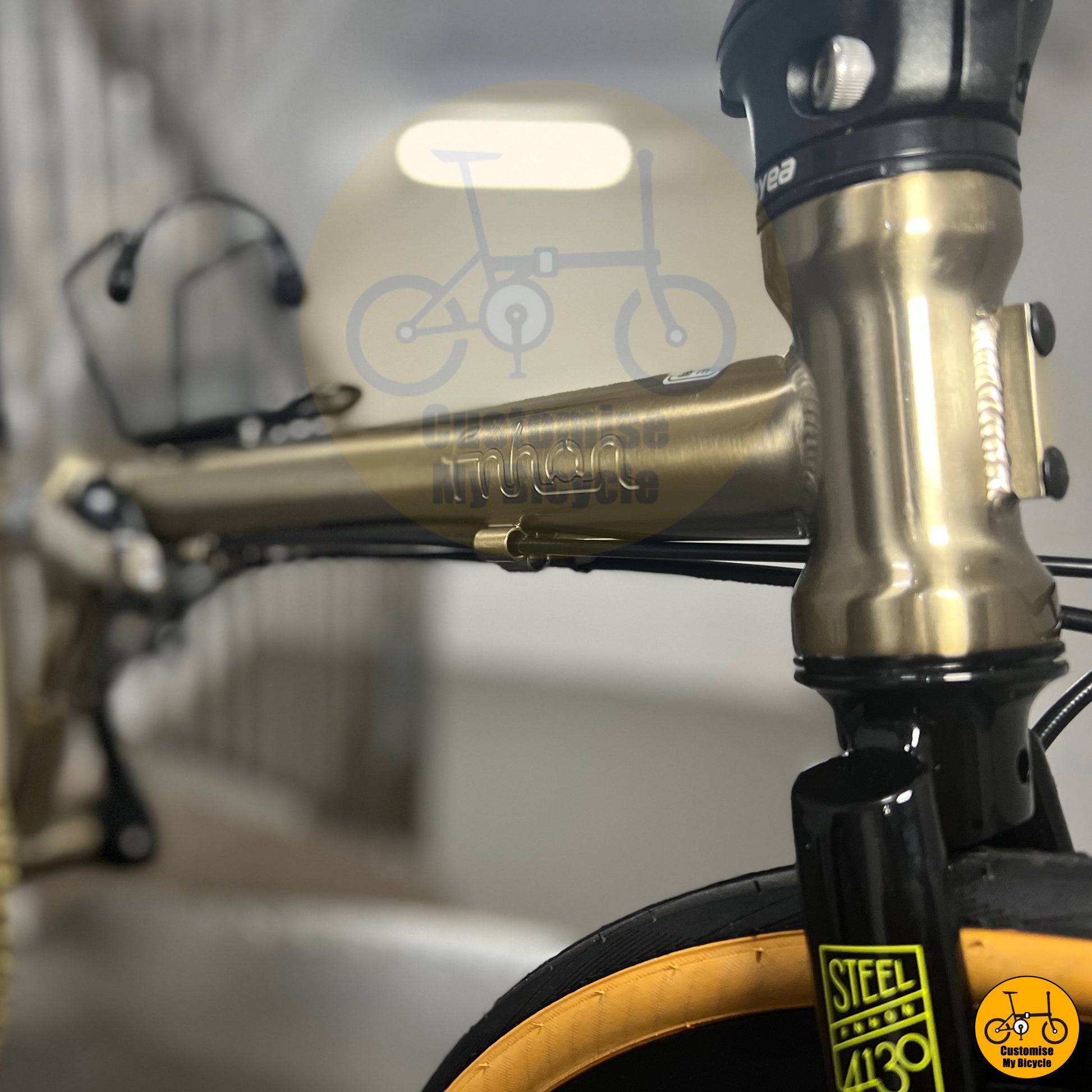 Folding bike featuring a titanium gold chainring for a luxurious touch
