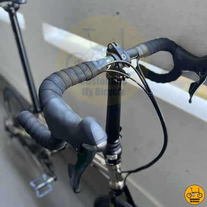 Lightweight titanium gold frame folding bicycle with a sleek design
