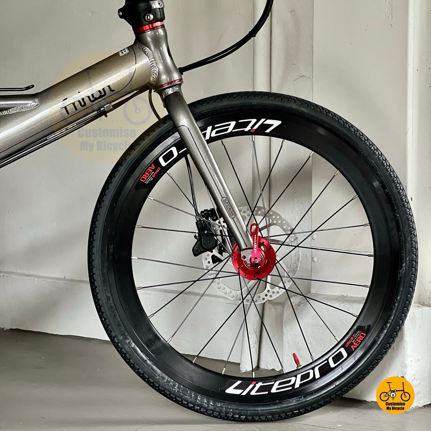 Dolphin Grey folding bike with red parts side view  
