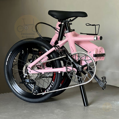 Fnhon Monsoon 20" Baby Pink folding bike in compact folded configuration