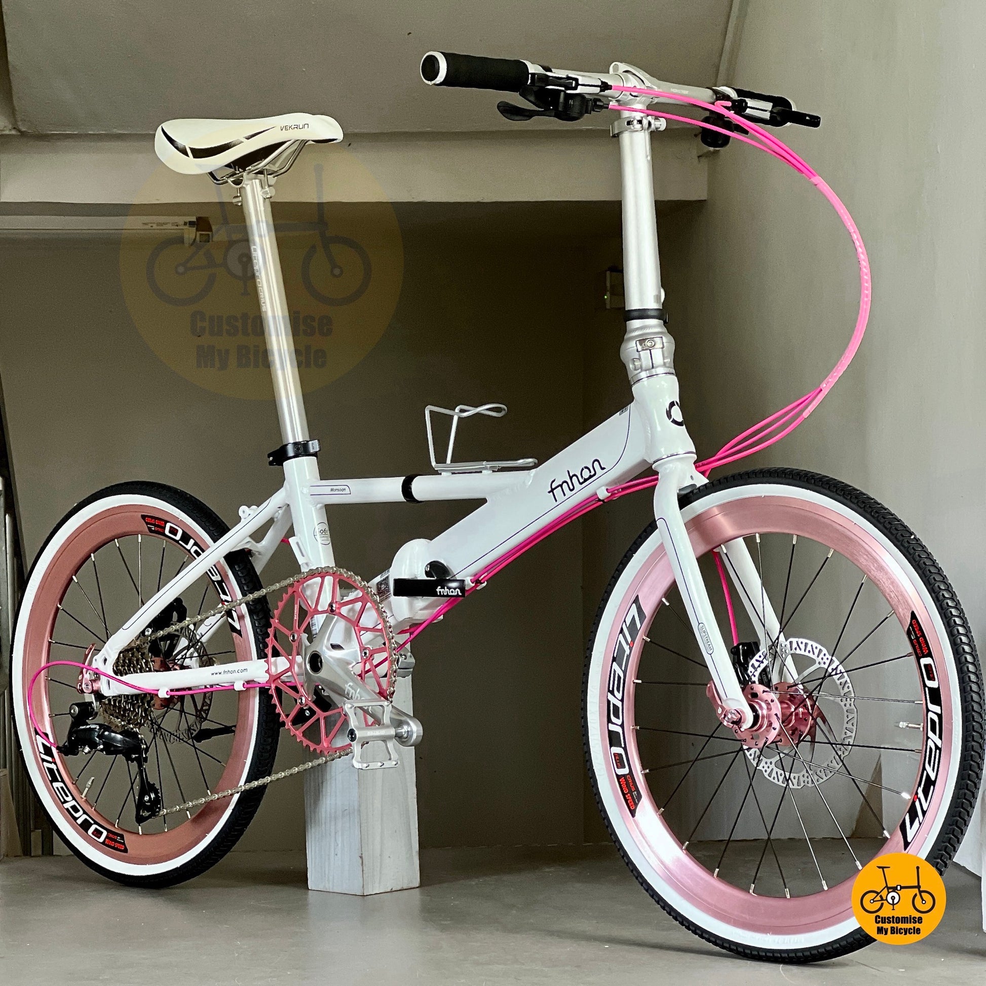 Dreamy White pink-accent foldable bike with high profile wheels and GINEYEA pedals
