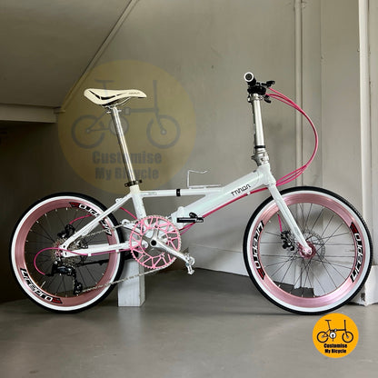 Folding bicycle in white pink with INNOVA tyres and adjustable handle post
