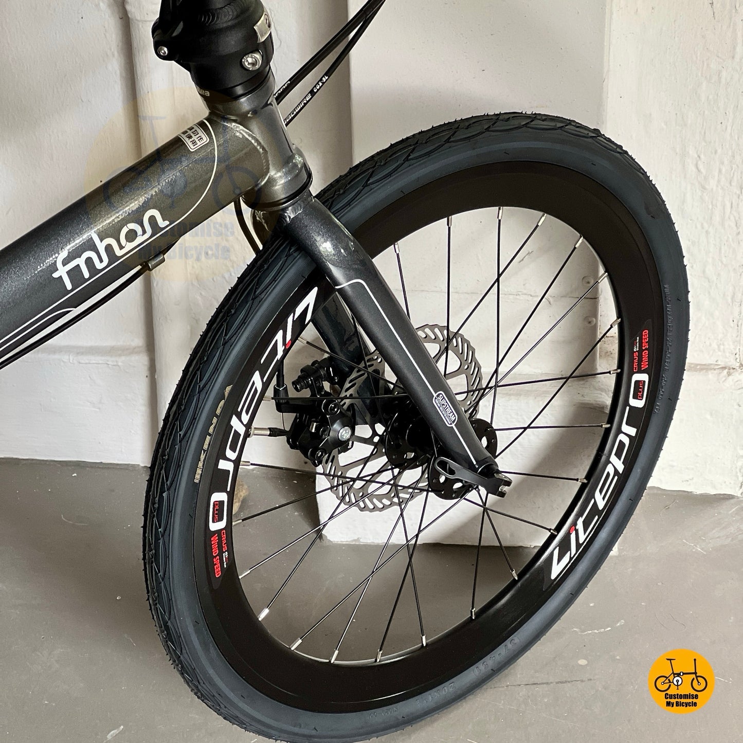 Front wheel close up showing Litepro Aero high profile rim and Kenda tyre  
