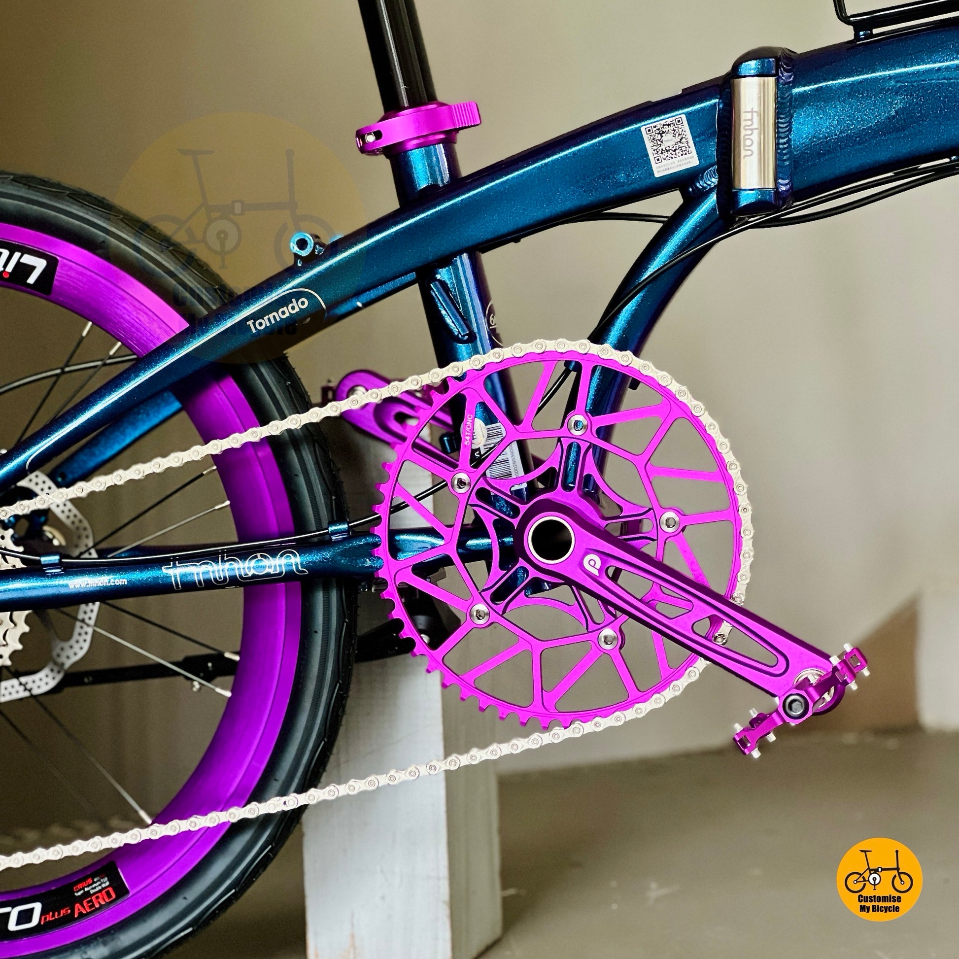 Purple Litepro Hollowtech crankset close up on lightweight folding bicycle