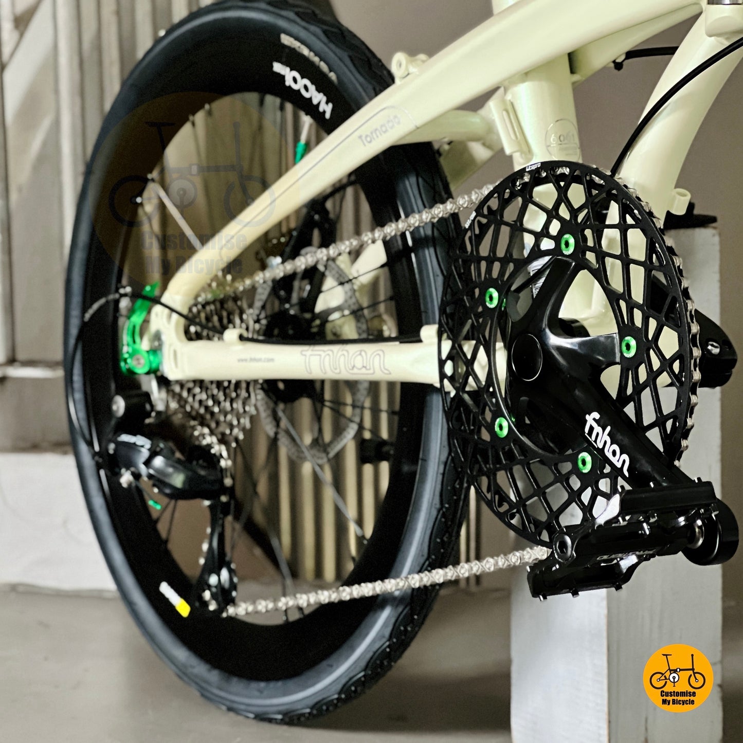 Close up FNHON Hollowtech crankset on beige folding bicycle