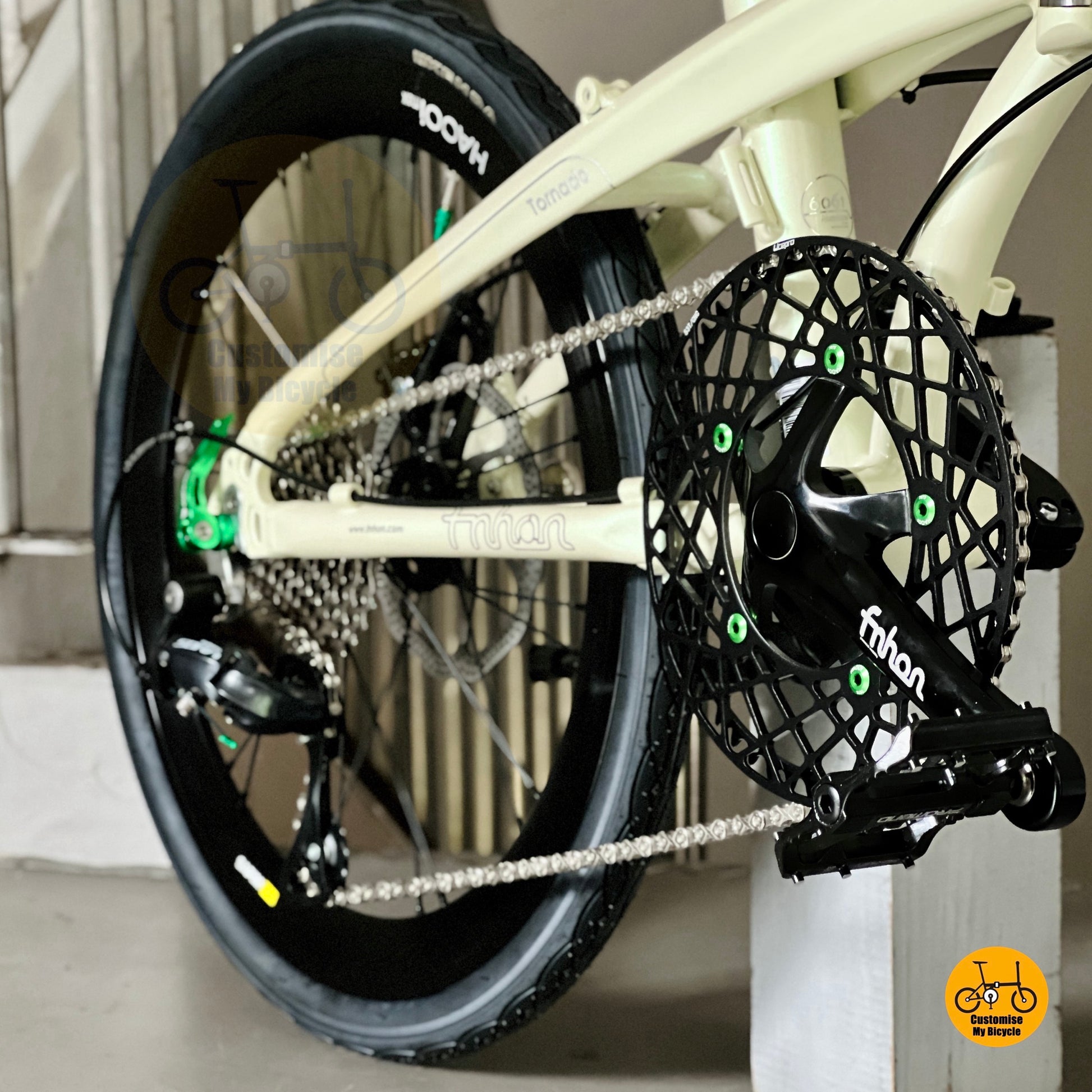 Close up FNHON Hollowtech crankset on beige folding bicycle