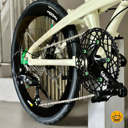 Close up FNHON Hollowtech crankset on beige folding bicycle