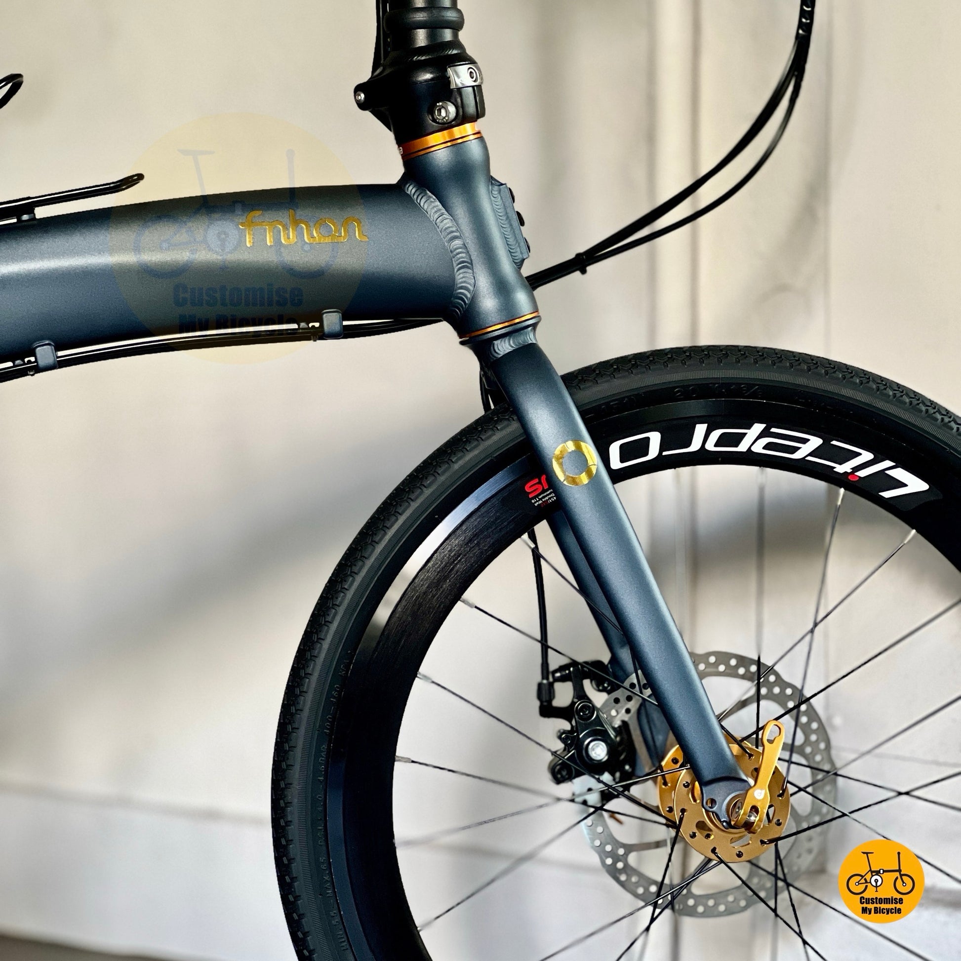 Side view of Fnhon Tornado in teal and gold  
