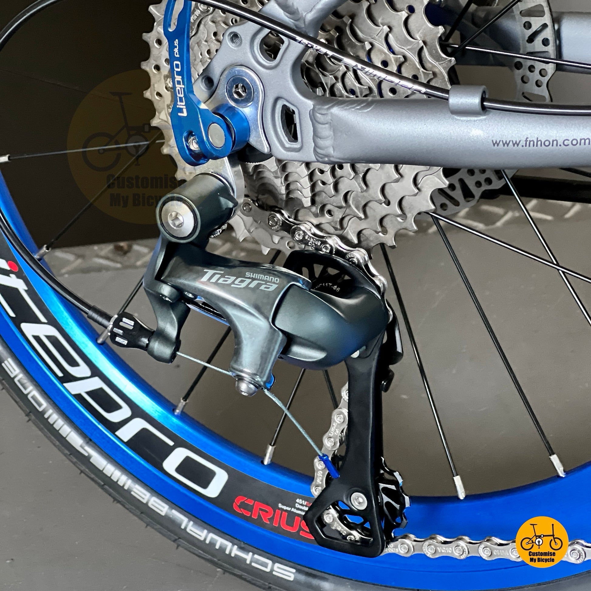 Close up of Shimano Tiagra 10 speed gear system on Fnhon Tornado folding bike Battleship Grey
