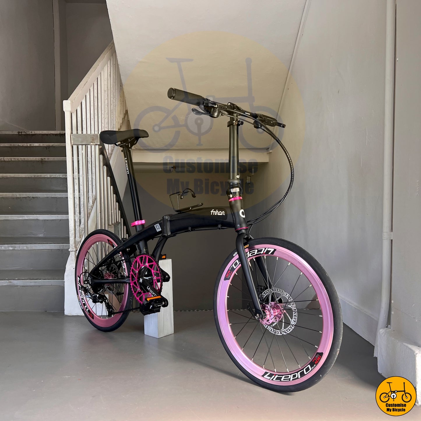 Elegant & Stylish Foldie – Baby Pink Wheels on a Sleek Matte Black Frame
