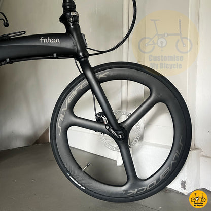 close-up of Silverock carbon trispoke wheels on folding bike
