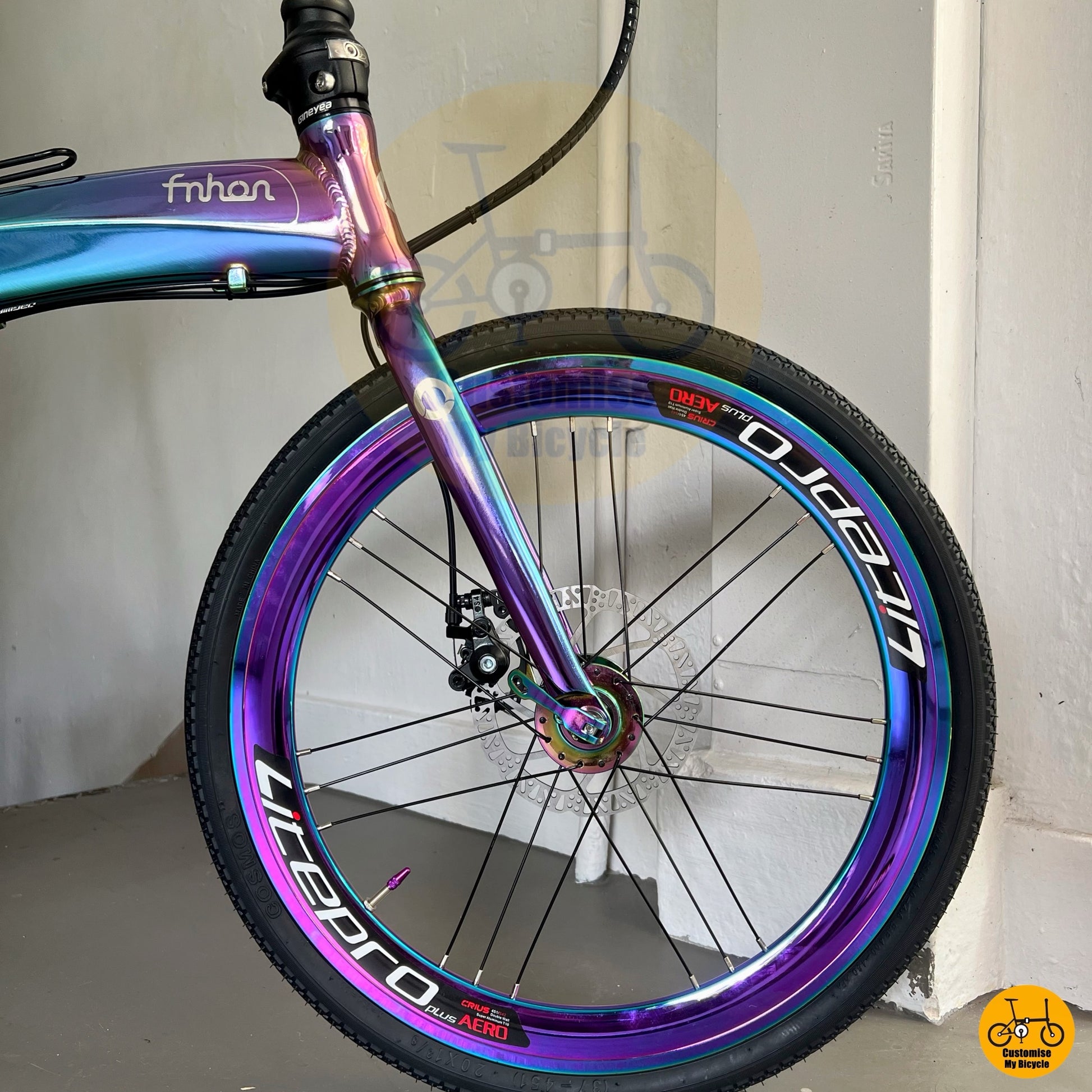 Litepro wheelset with matching rainbow oil slick spokes and hubs

