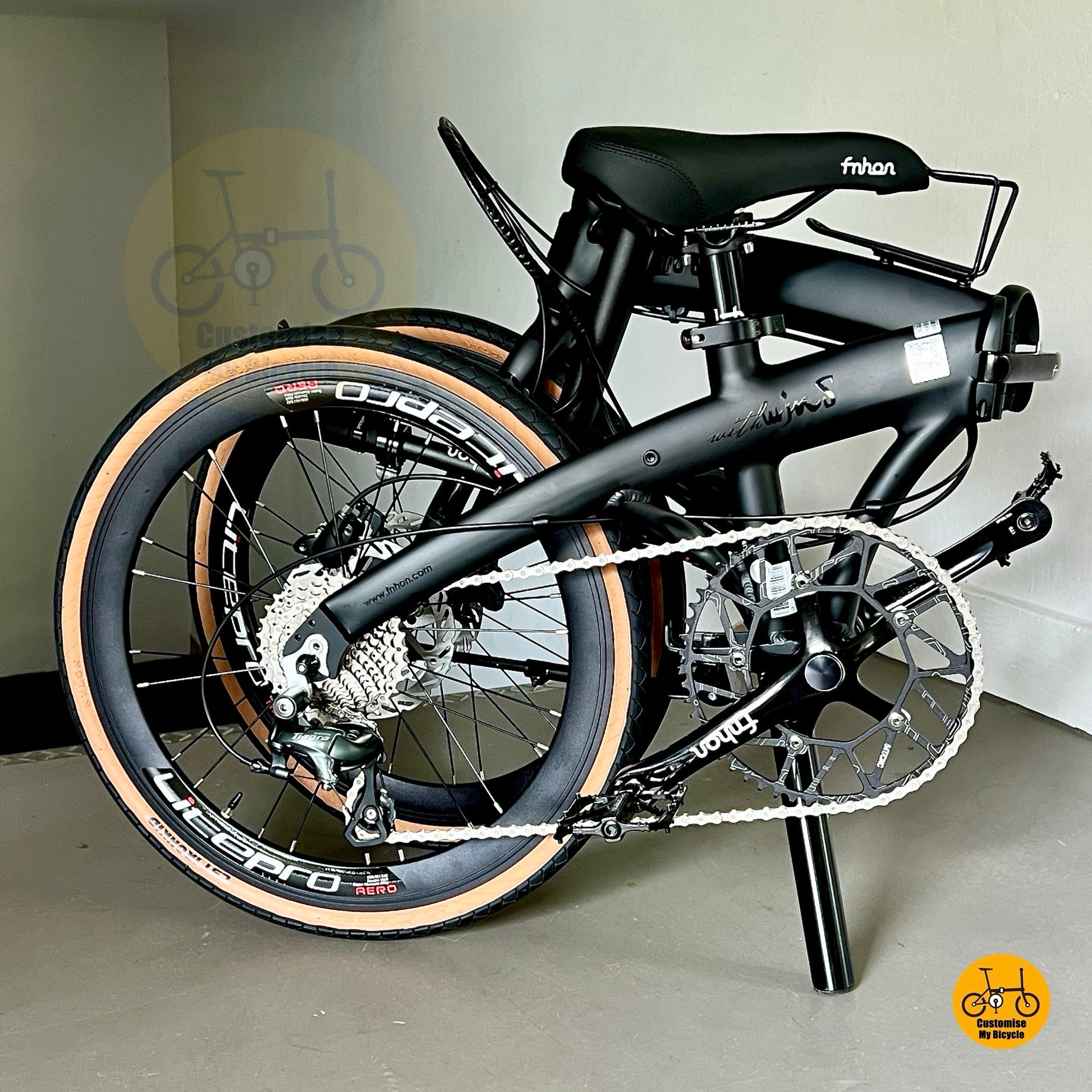 Compact folding design of Fnhon Wind 22 inch matte black bicycle with Litepro parts
