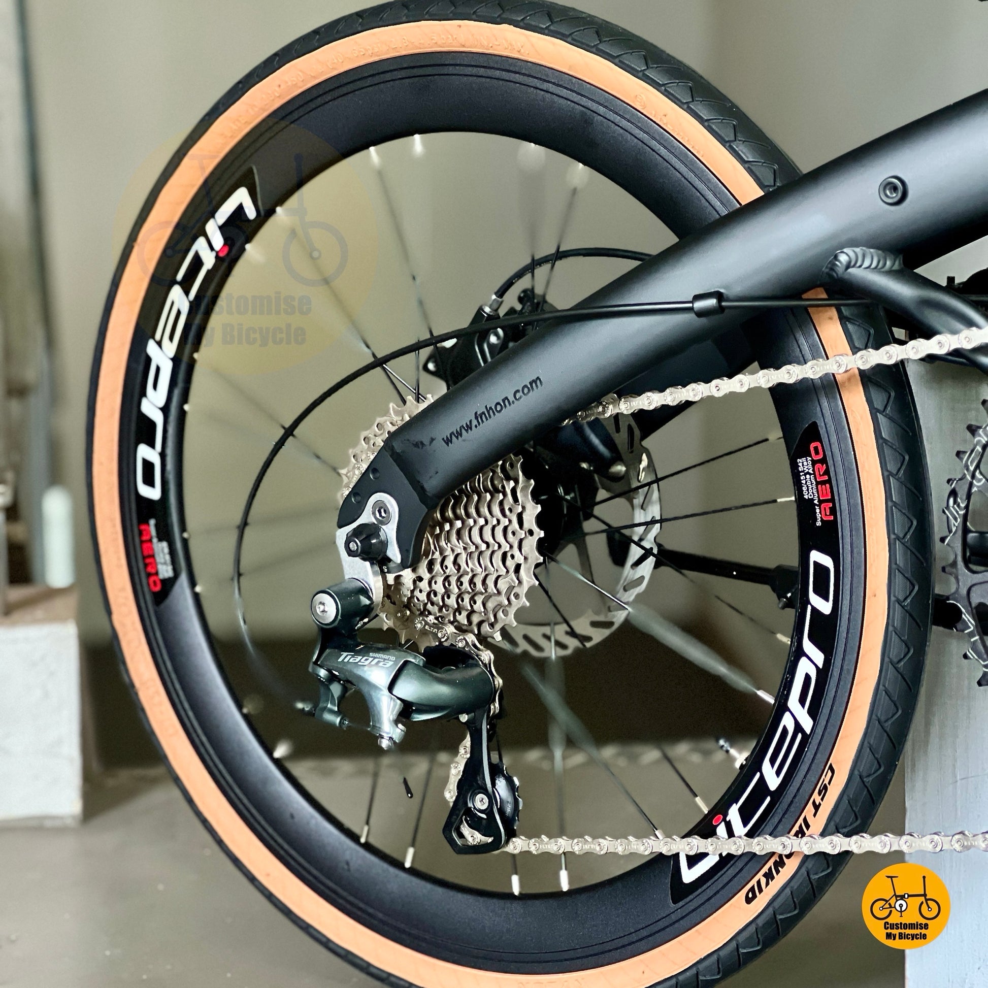 Close up of Shimano Tiagra 10 gears on Fnhon Wind matte black folding bicycle
