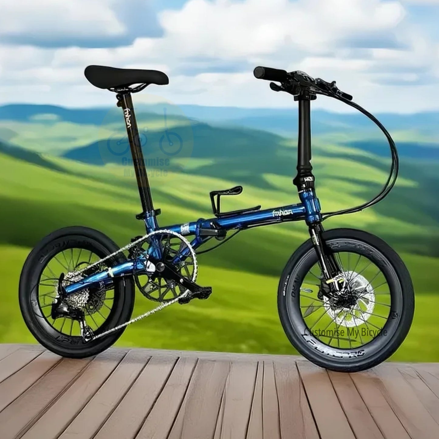 Foldable bicycle on a wooden deck with a scenic background of green fields and blue sky.